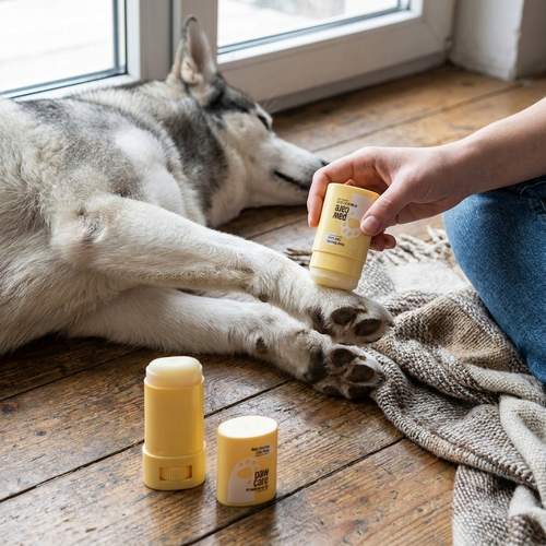 Pet paw balm cream in use